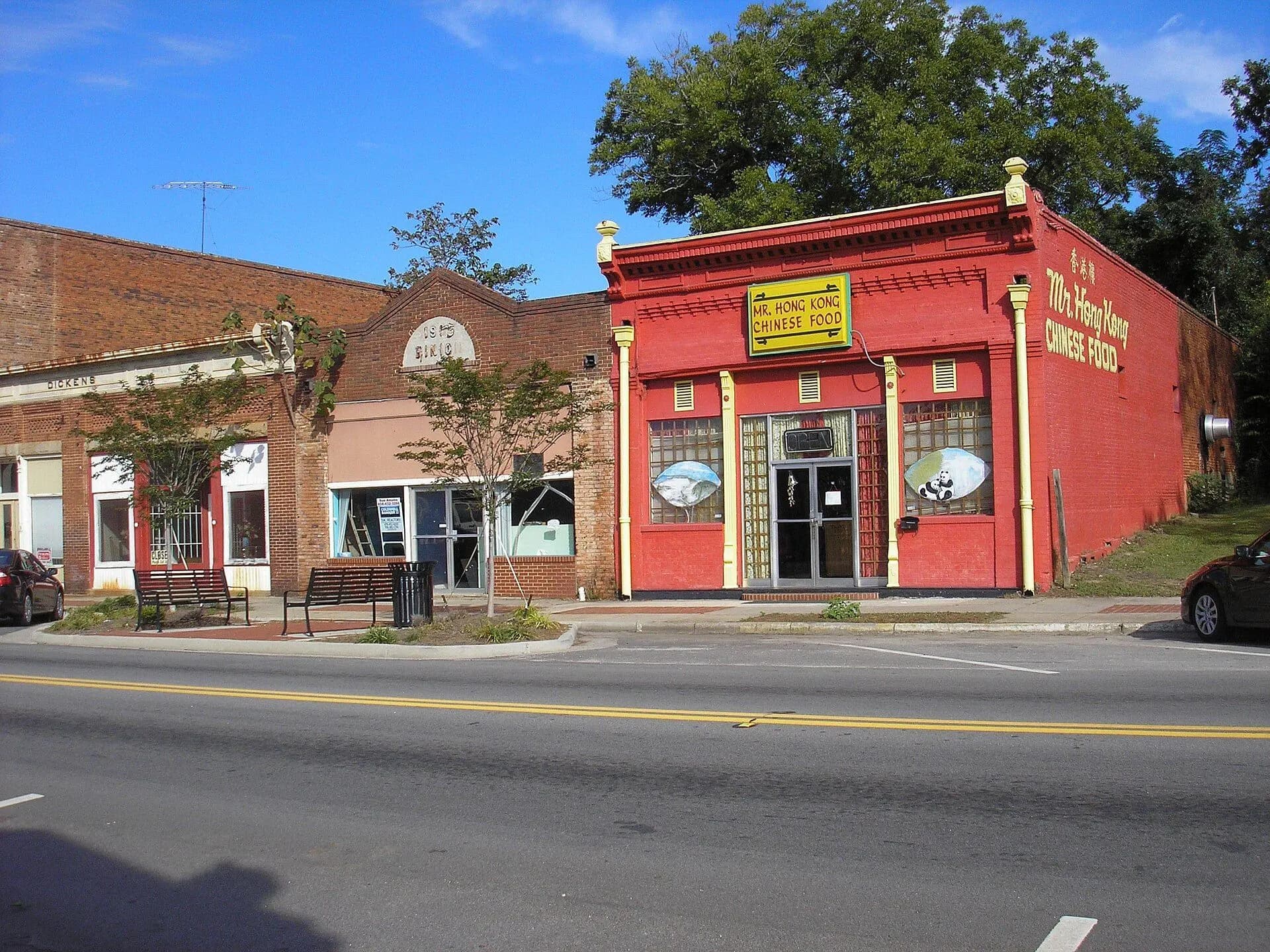 A row of old brick storefronts along a quiet street in the Sparta Historic District, Georgia.